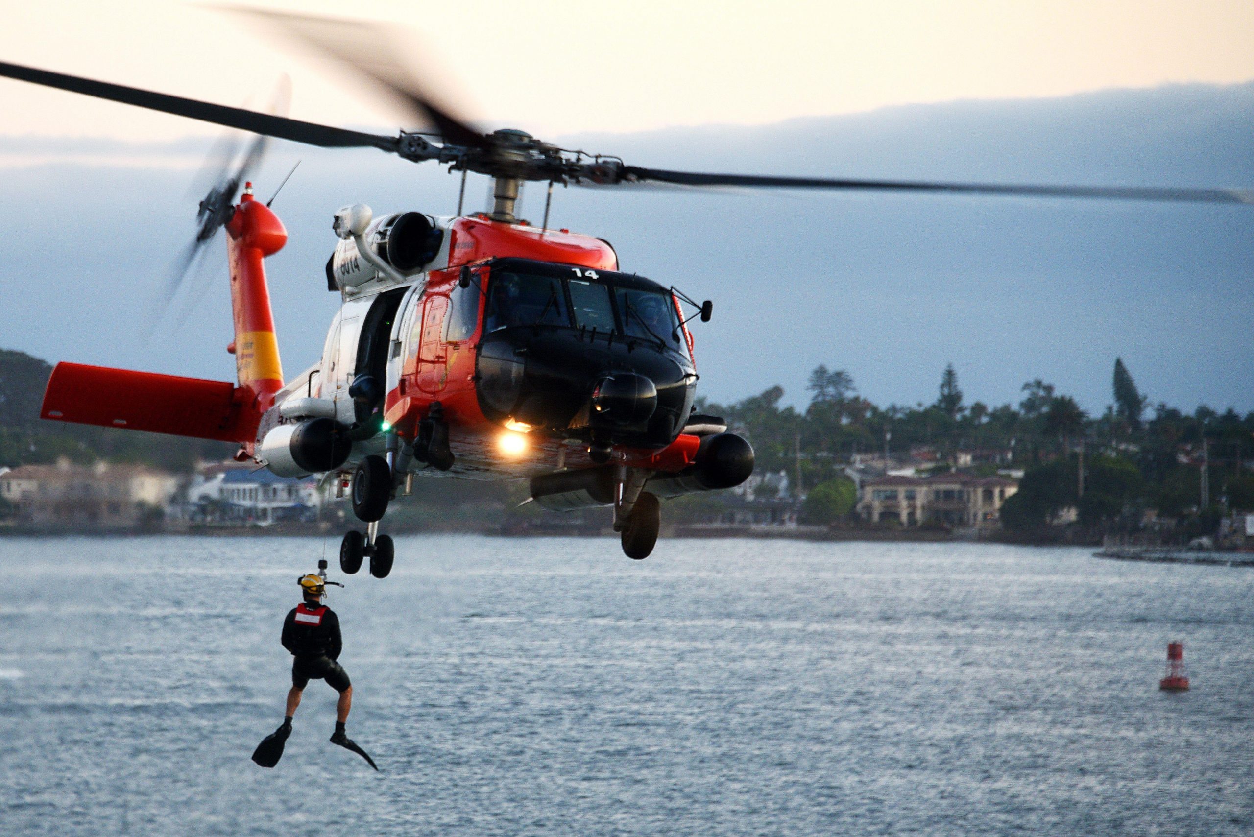 A U.S. Coast Guard Sector San Diego MH-60T Jayhawk helicopter crew conducts a search and rescue demonstration